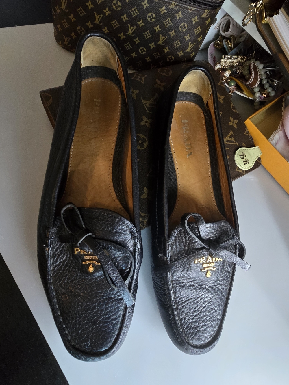 Prada Black Pebbled Leather Bow Loafers with Gold Logo